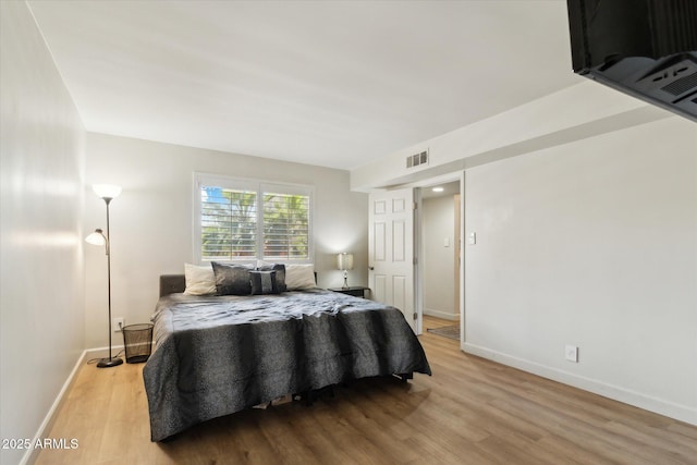 7625 E Camelback Rd Unit B226, Scottsdale, AZ 85251 - bedroom featuring wood finished floors and baseboards