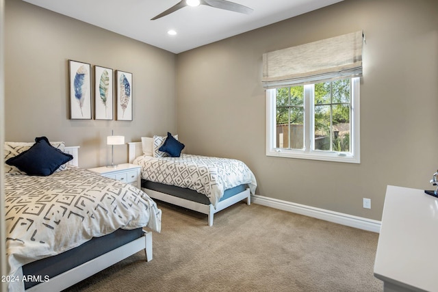 carpeted bedroom with ceiling fan