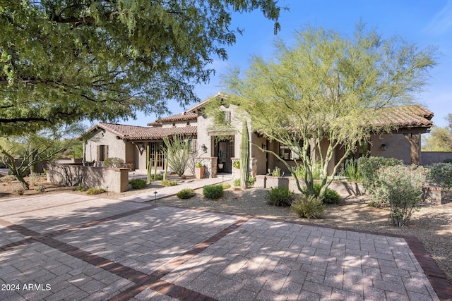 mediterranean / spanish-style house featuring a patio