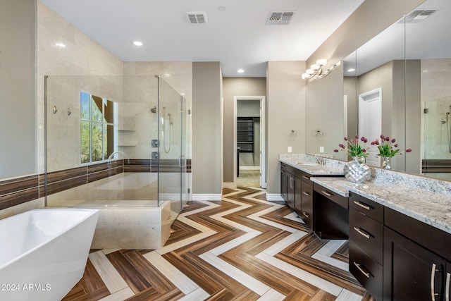 bathroom featuring vanity and plus walk in shower