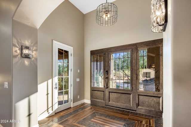 entryway with an inviting chandelier and french doors