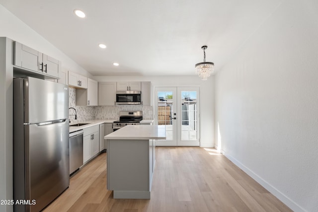3646 N 69th Ave Unit 55, Phoenix, AZ 85033 - kitchen featuring a sink, gray cabinetry, and stainless steel appliances