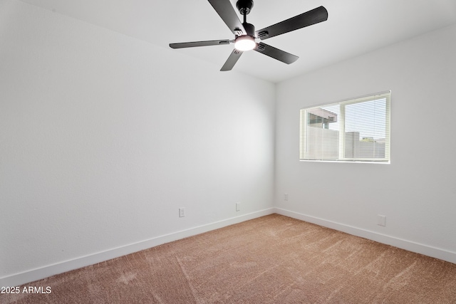 3646 N 69th Ave Unit 55, Phoenix, AZ 85033 - spare room with light colored carpet, baseboards, and a ceiling fan