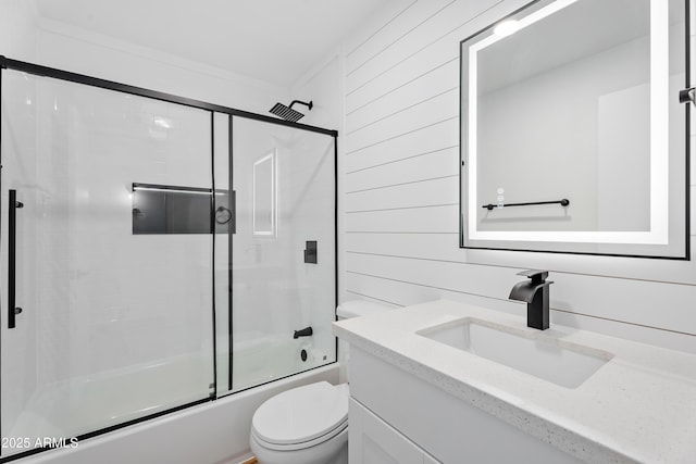 3646 N 69th Ave Unit 55, Phoenix, AZ 85033 - full bath featuring wood walls, toilet, vanity, and enclosed tub / shower combo