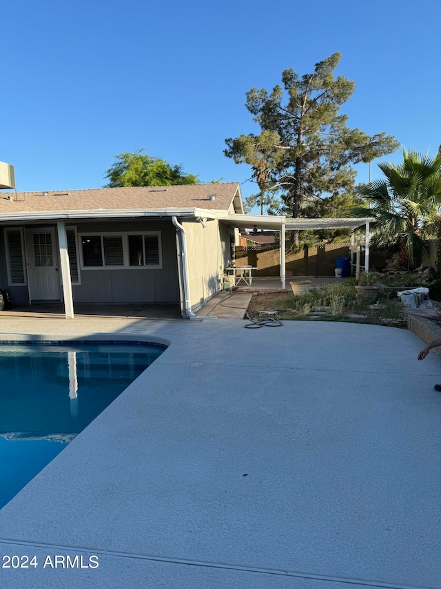 view of swimming pool featuring a patio area