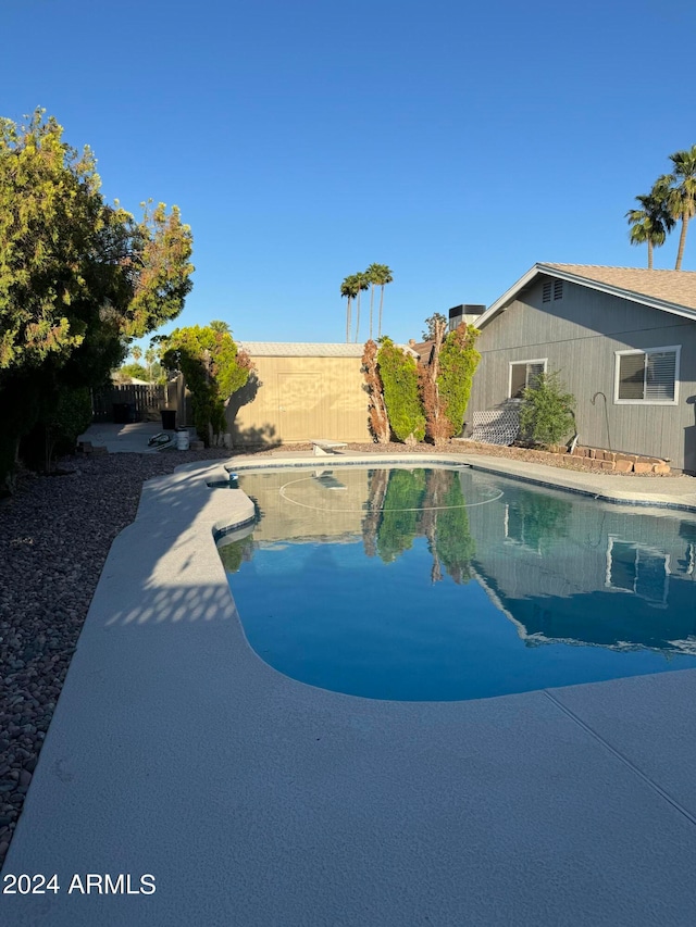 view of swimming pool with a patio area