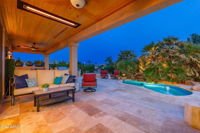 patio terrace at dusk featuring an outdoor living space, ceiling fan, and a fenced in pool