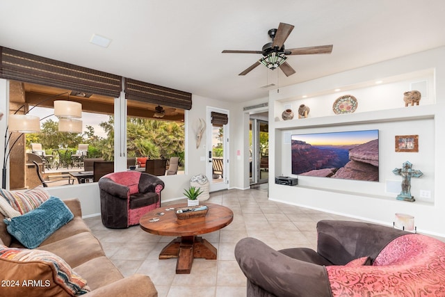 tiled living room featuring ceiling fan