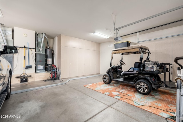 garage with a garage door opener and water heater