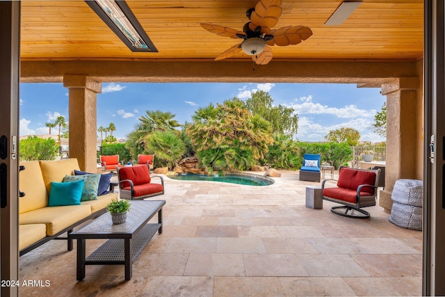 view of patio / terrace featuring ceiling fan and an outdoor living space