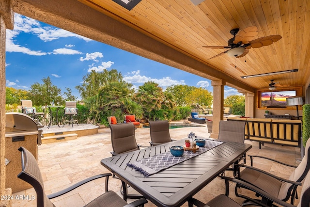 view of patio with grilling area and ceiling fan