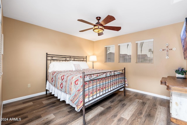 bedroom featuring ceiling fan and dark wood-type flooring