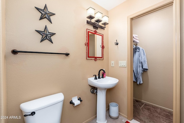 bathroom with toilet and sink