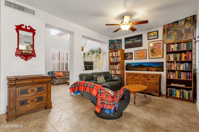 sitting room with visible vents, ceiling fan, and tile patterned floors