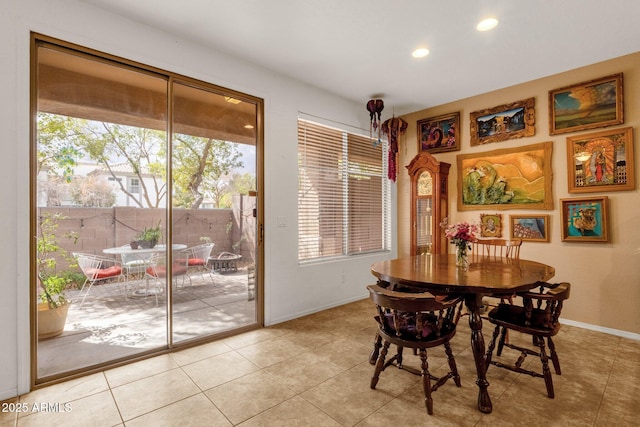 dining room featuring light tile patterned floors, baseboards, and recessed lighting