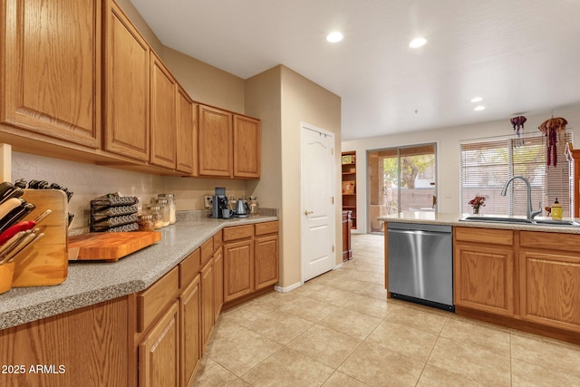 kitchen featuring recessed lighting, light countertops, stainless steel dishwasher, light tile patterned flooring, and a sink