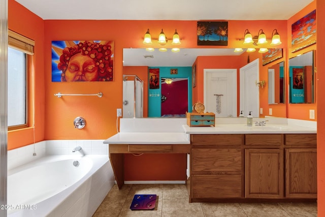 full bath with a stall shower, tile patterned flooring, a garden tub, and vanity