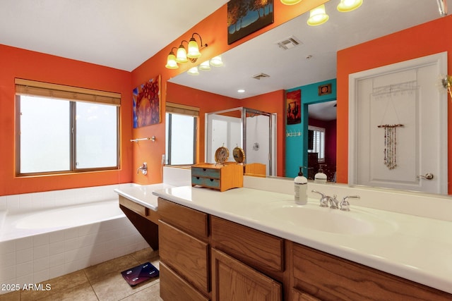 bathroom featuring a garden tub, visible vents, a stall shower, vanity, and tile patterned floors