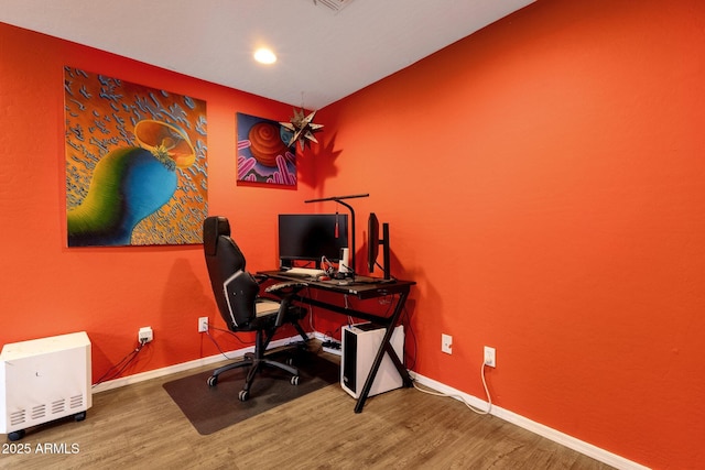 office with baseboards and wood finished floors