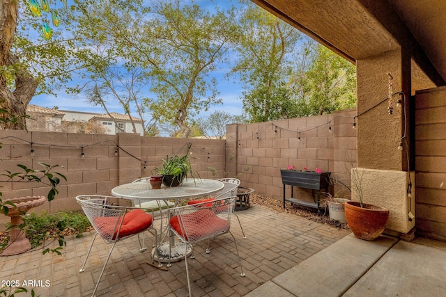 view of patio / terrace featuring a fenced backyard and outdoor dining area