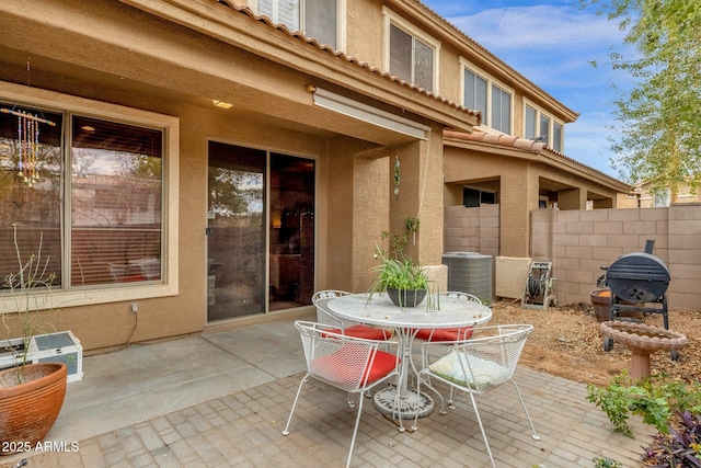 view of patio / terrace with outdoor dining area and fence