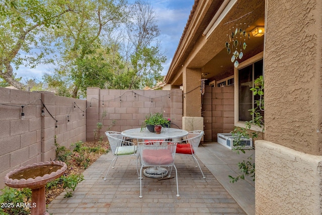 view of patio / terrace with a fenced backyard and outdoor dining space