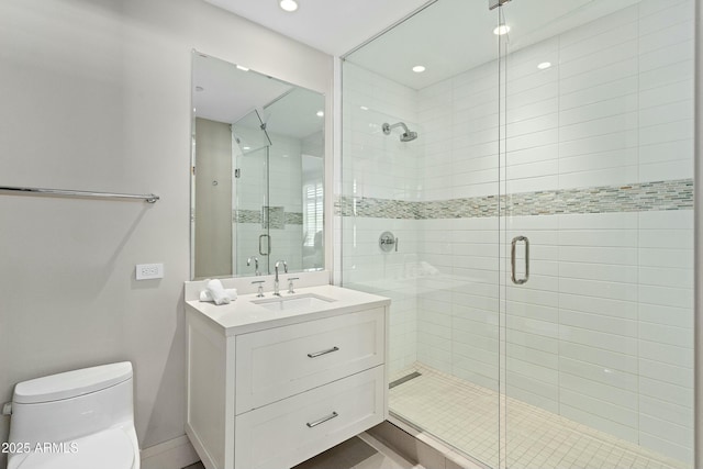 bathroom featuring a stall shower, vanity, toilet, and recessed lighting