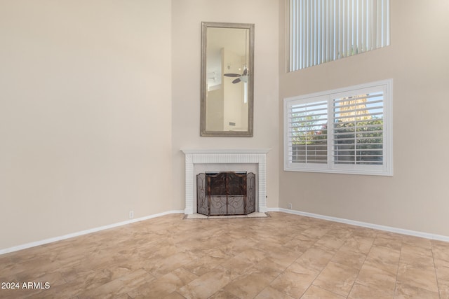 unfurnished living room with a brick fireplace