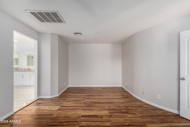 spare room featuring dark hardwood / wood-style floors