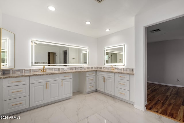 bathroom with vanity and wood-type flooring