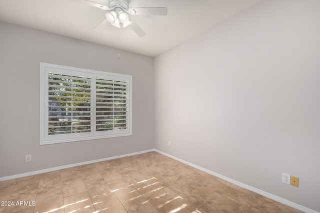 spare room with ceiling fan