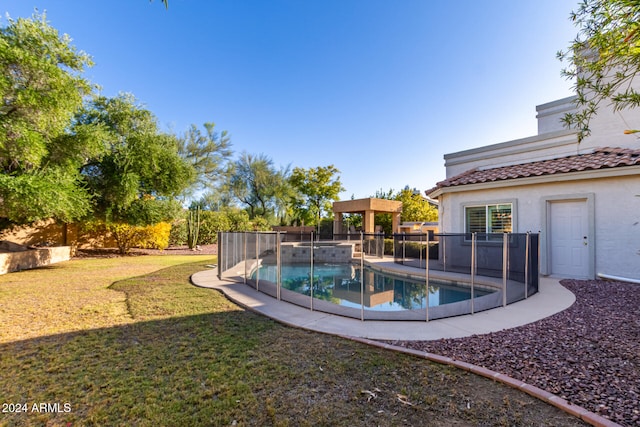 view of pool featuring a yard