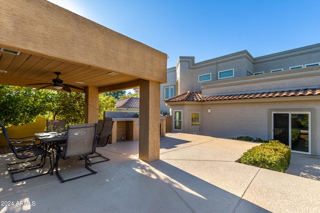 view of patio featuring ceiling fan