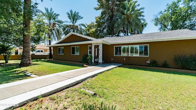 ranch-style house with a front yard