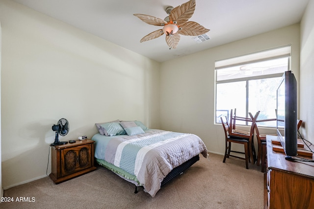 bedroom featuring ceiling fan and light colored carpet