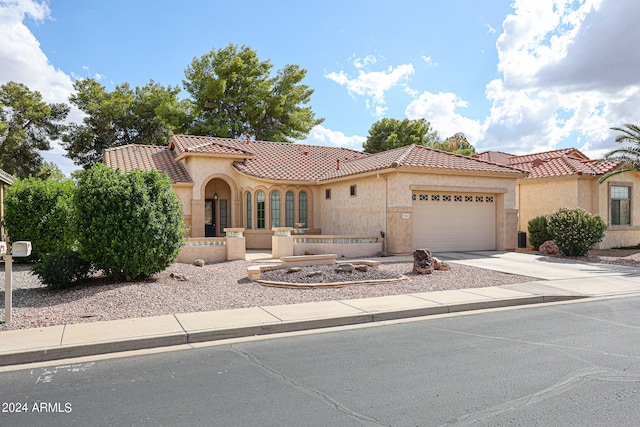 mediterranean / spanish-style house featuring a garage