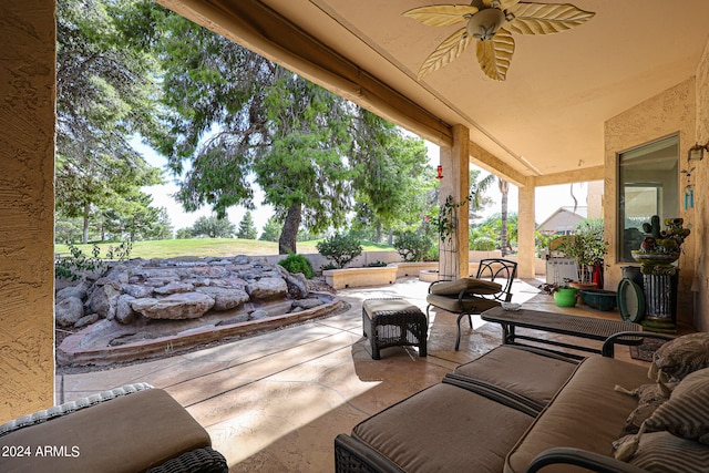 view of patio / terrace with ceiling fan and outdoor lounge area