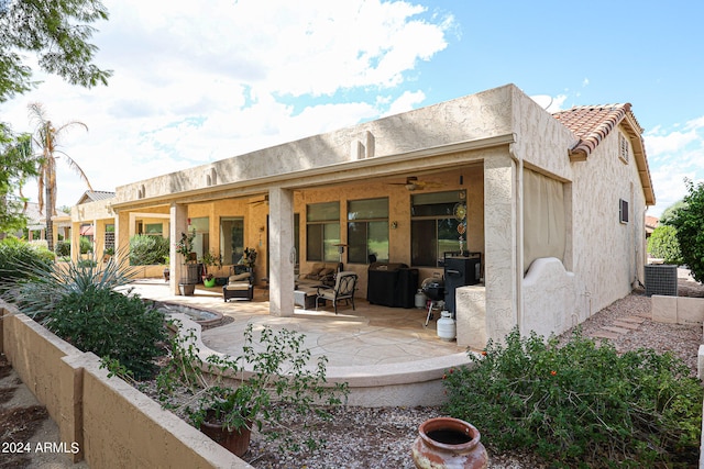 rear view of house featuring ceiling fan, central AC, and a patio area