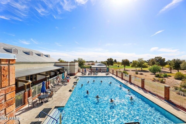 view of swimming pool with a patio area