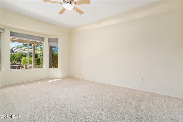 carpeted empty room with ceiling fan