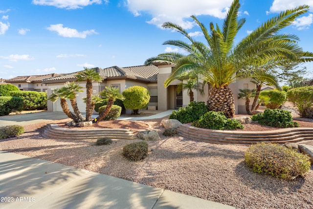 mediterranean / spanish-style house featuring a garage