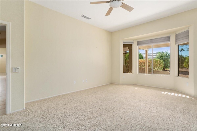 carpeted empty room with ceiling fan