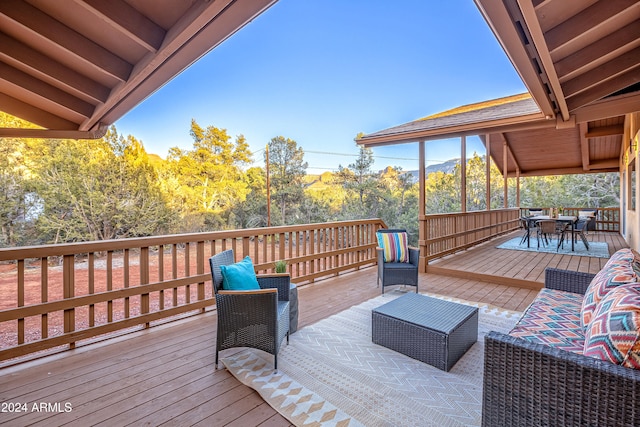 wooden deck featuring outdoor lounge area