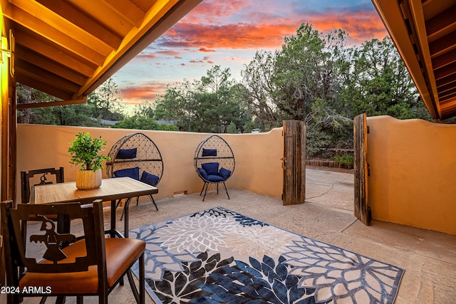 view of patio terrace at dusk