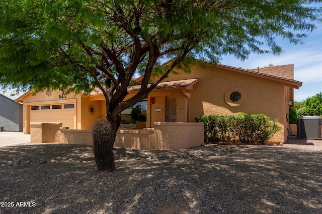 922 S 80th St, Mesa, AZ 85208 - view of front of home featuring central air condition unit, an attached garage, driveway, and stucco siding