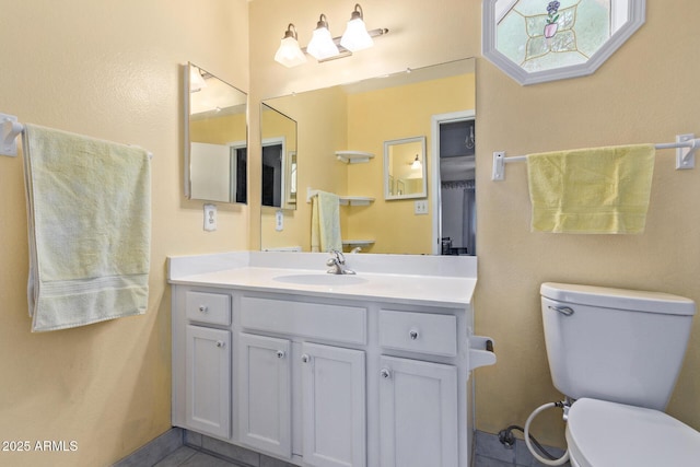 922 S 80th St, Mesa, AZ 85208 - bathroom with vanity, toilet, and tile patterned flooring