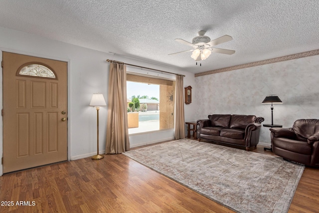 922 S 80th St, Mesa, AZ 85208 - living area featuring a textured ceiling, ceiling fan, wood finished floors, and baseboards