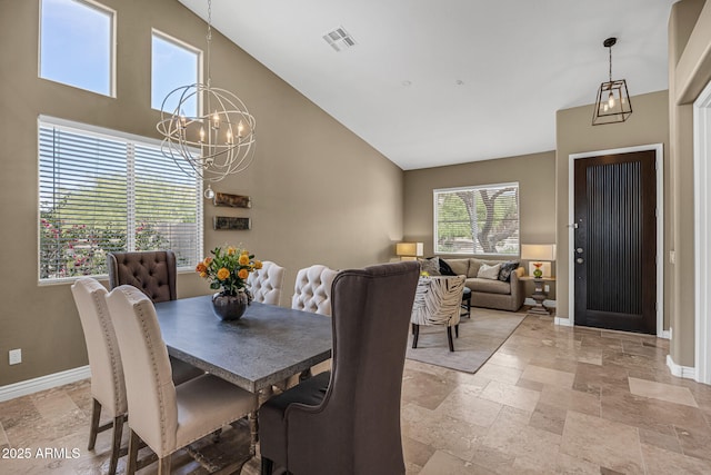 10623 E Acacia Dr, Scottsdale, AZ 85255 - dining area with high vaulted ceiling, a notable chandelier, stone tile flooring, visible vents, and baseboards