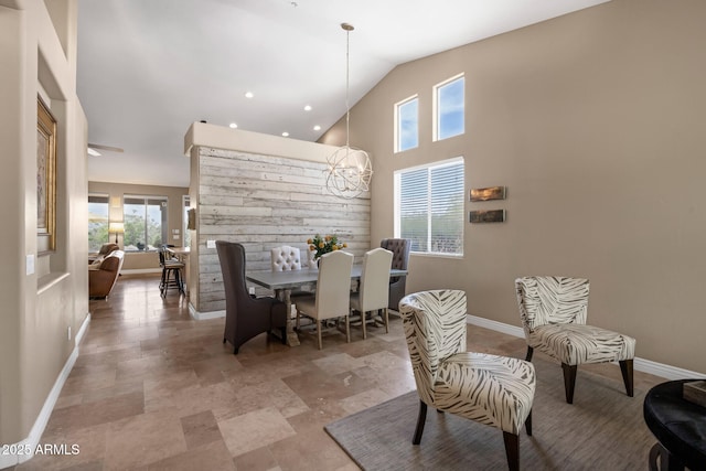 10623 E Acacia Dr, Scottsdale, AZ 85255 - dining area with an inviting chandelier, vaulted ceiling, and baseboards
