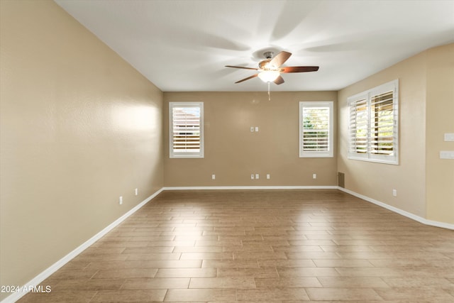 unfurnished room featuring light wood-type flooring and ceiling fan